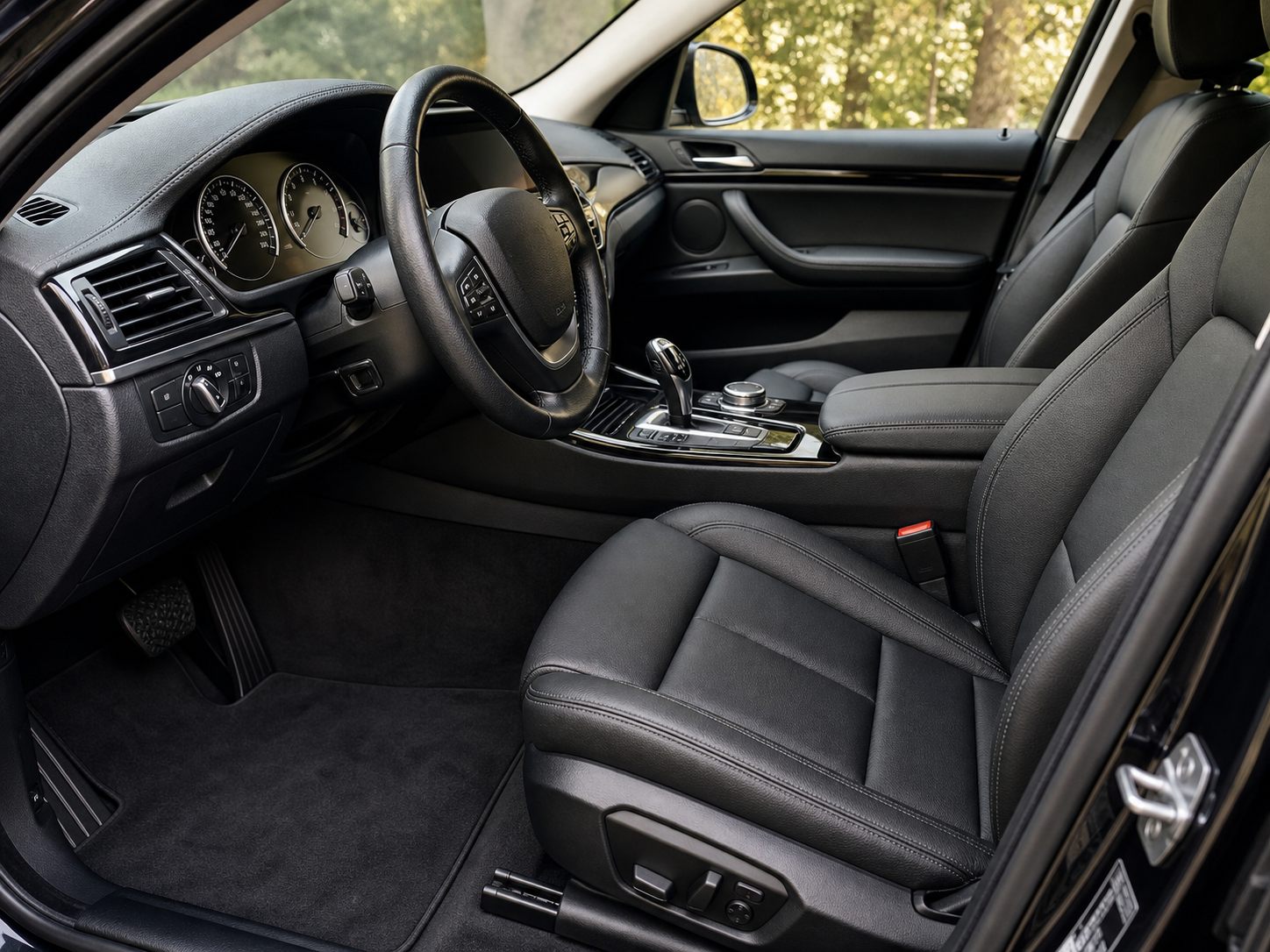 Spotless black leather interior after deep detailing